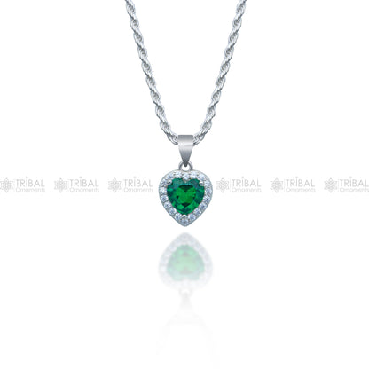 925 Sterling silver heart-shaped pendant set with green emerald diamonds, featuring a tribal-inspired design and intricate details.