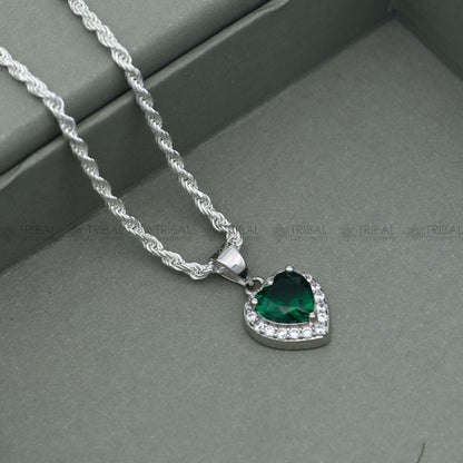925 Sterling silver heart-shaped pendant set with green diamond (emerald) accents, featuring intricate tribal ornament design.