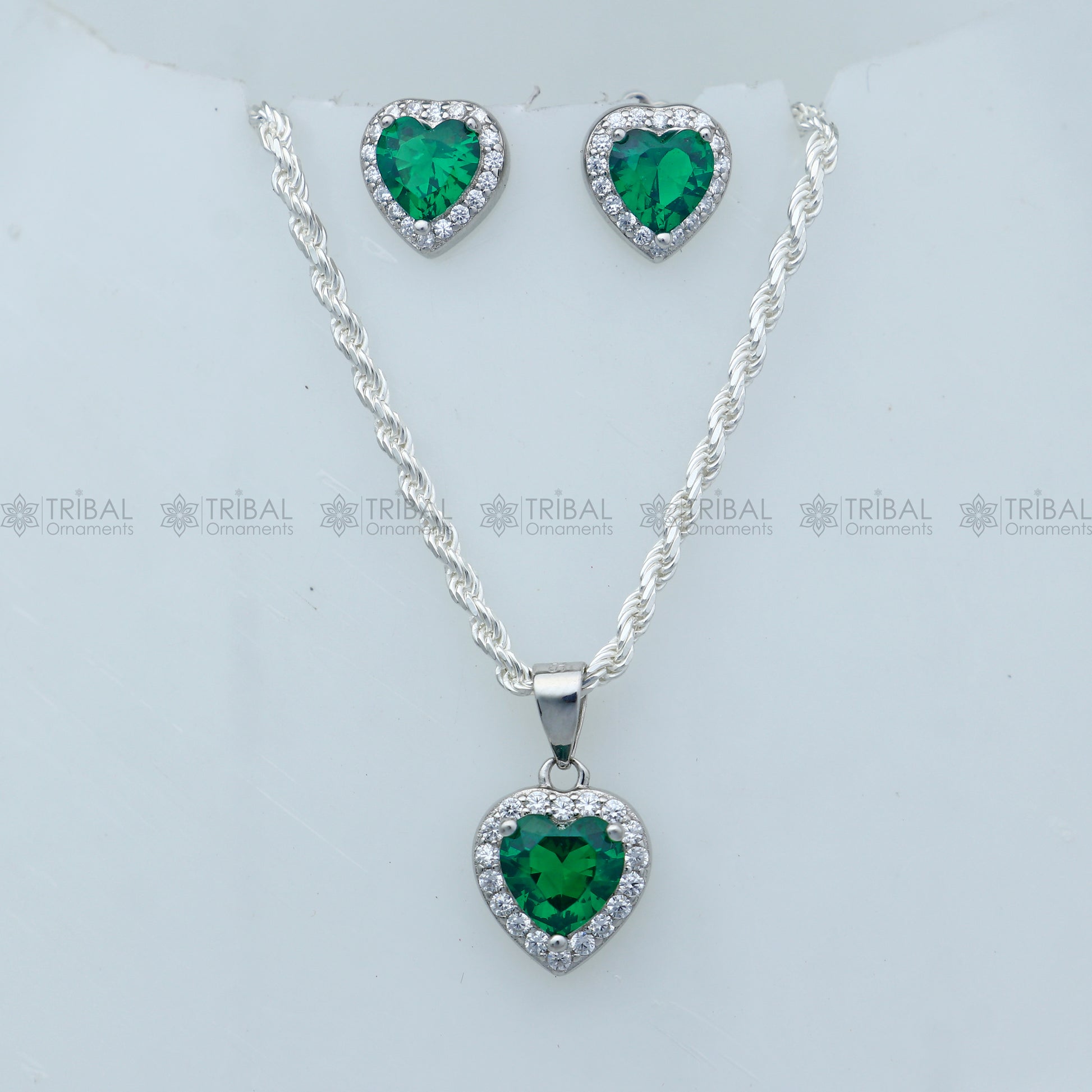 Sterling silver green diamond emerald heart-shaped pendant set by Tribal Ornaments, featuring intricate design and vibrant gemstone details.