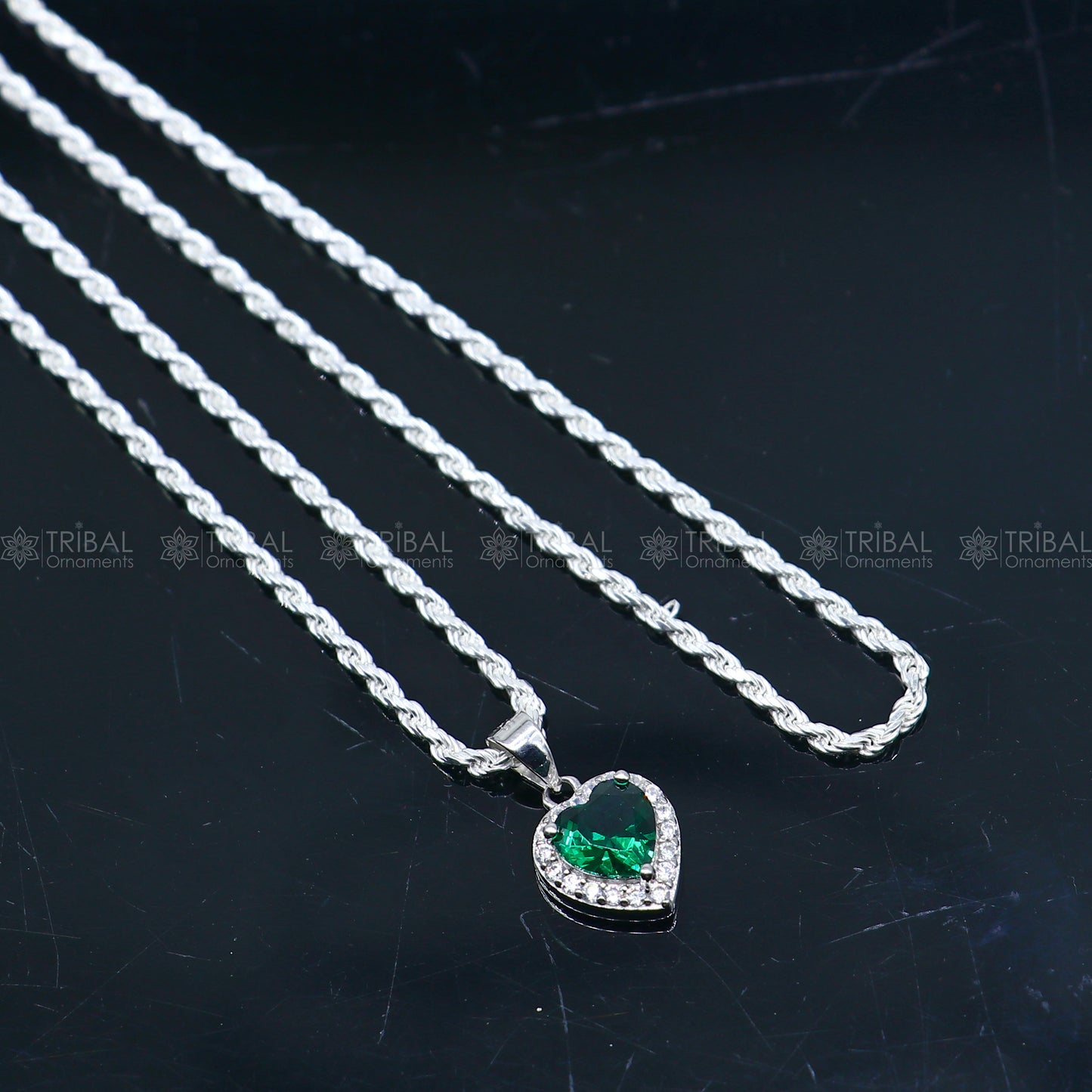 925 Sterling silver heart-shaped pendant set with green diamond (emerald), featuring a tribal ornament design.