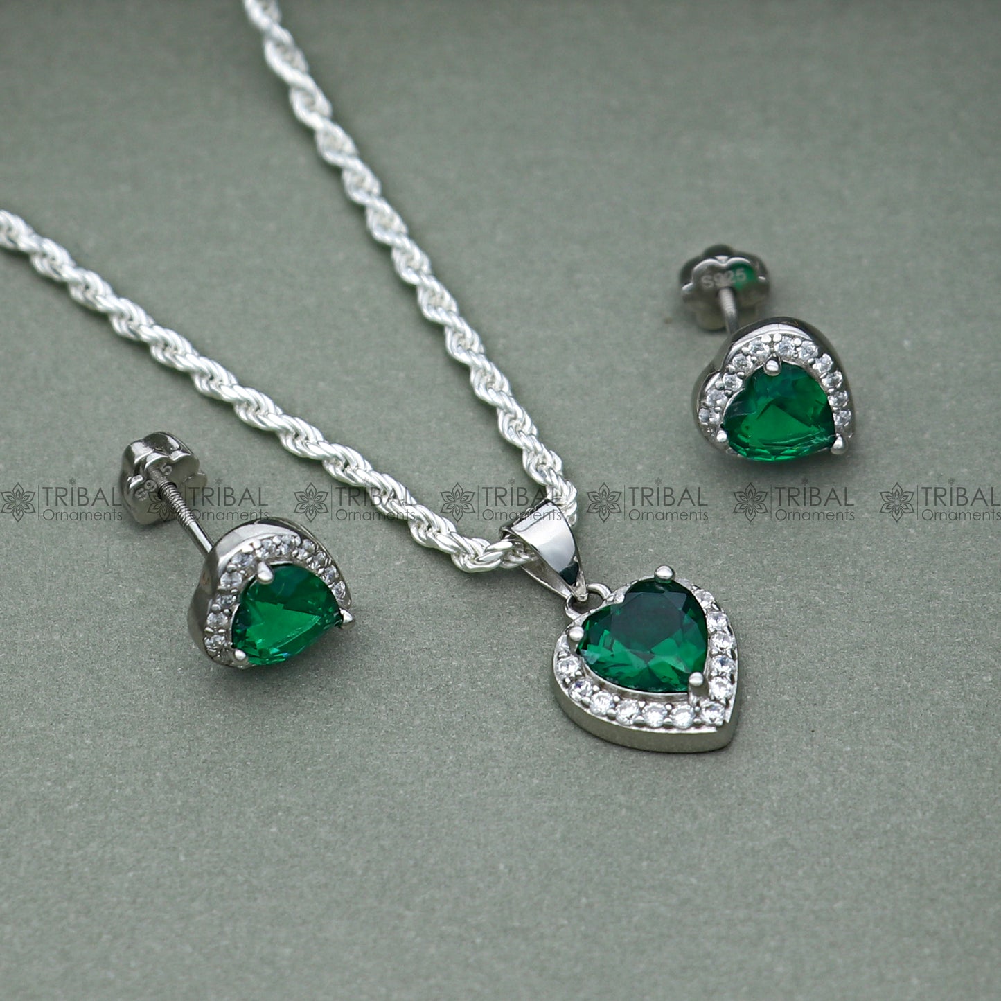 925 Sterling silver heart-shaped pendant set with green emerald diamond accents, crafted by TRIBAL ORNAMENTS.