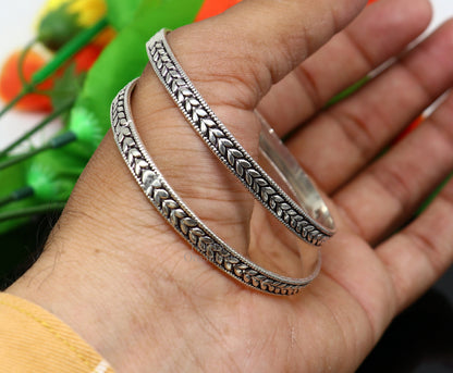 Sterling silver handcrafted floral design bangles bracelet by TRIBAL ORNAMENTS, stylish tribal belly dance jewelry with intricate floral patterns.