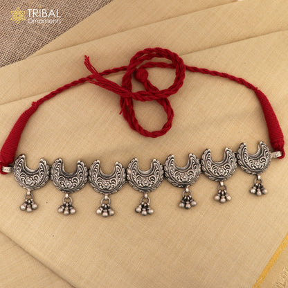Sterling silver tribal charm necklace and jewelry set with handcrafted ethnic design, featuring stylish and intricate tribal motifs.