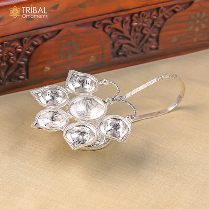 Sterling silver handmade Aarti lamp with intricate temple art design, perfect for home decor and spiritual rituals.