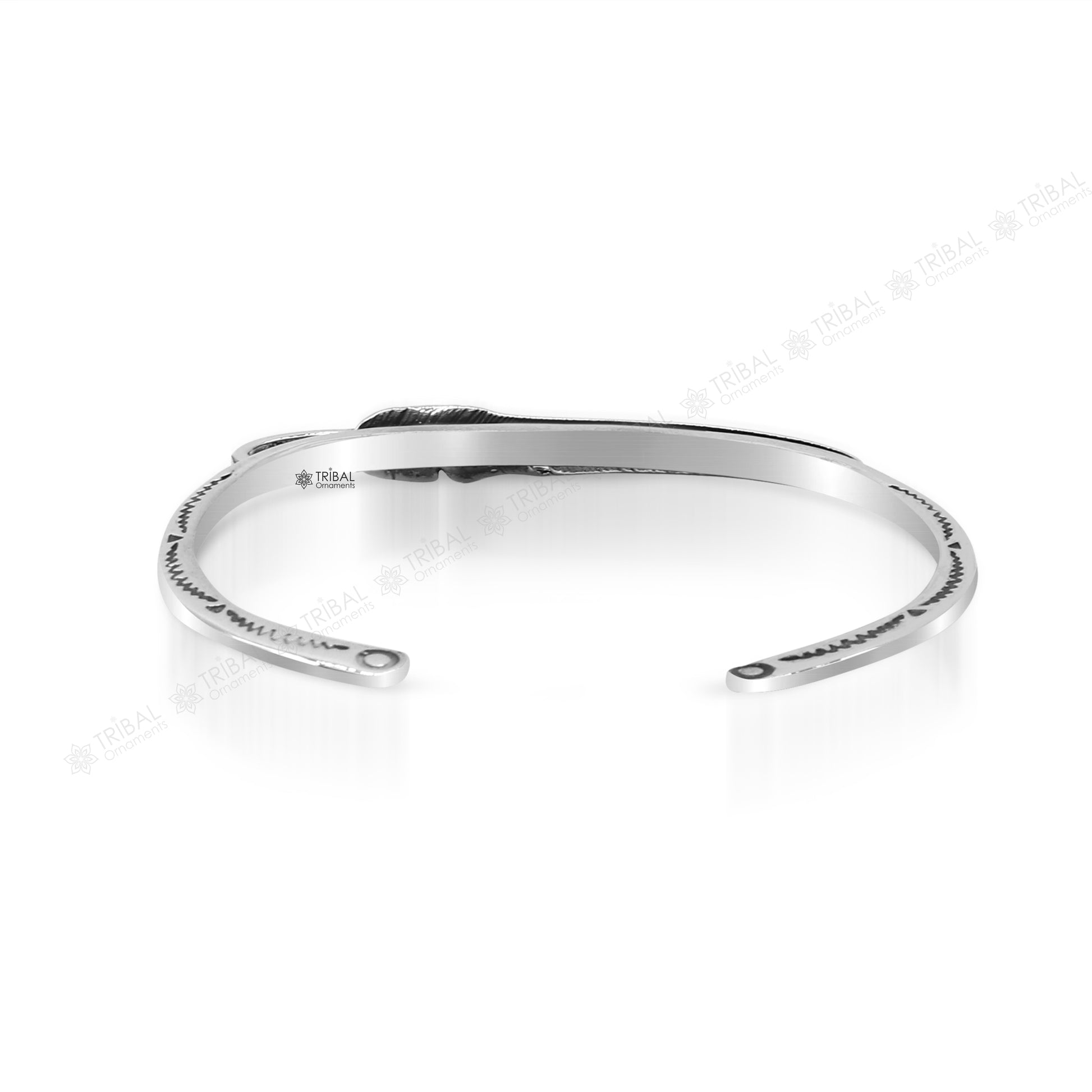 Sterling silver feather design adjustable cuff bracelet by TRIBAL ORNAMENTS, unisex modern jewelry with intricate feather detailing.
