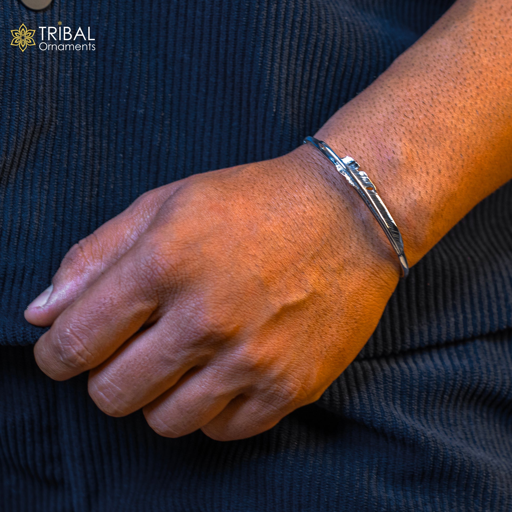Sterling silver feather design adjustable cuff bracelet by TRIBAL ORNAMENTS, unisex modern jewelry with stylish and handmade details.