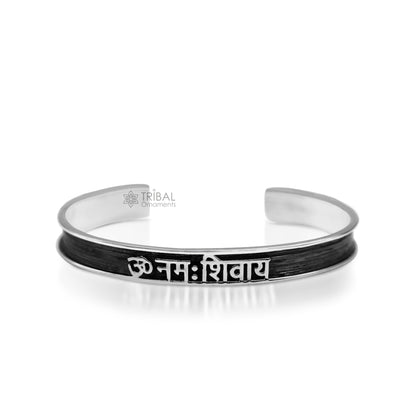 Sterling silver OM Namah Shivay mantra cuff bracelet by TRIBAL ORNAMENTS, unisex jewelry with open-face design and intricate Aum detailing.