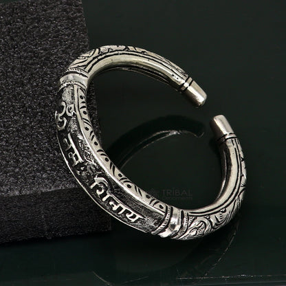 Sterling silver handmade Lord Shiva "Om Namah Shivay" mantra bracelet featuring tribal chitai work, unisex ethnic jewelry.