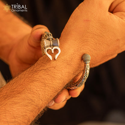 Sterling silver handmade Lord Shiva trident Trishul bangle bracelet with Chitai work, unisex design, customizable tribal ornament jewelry.