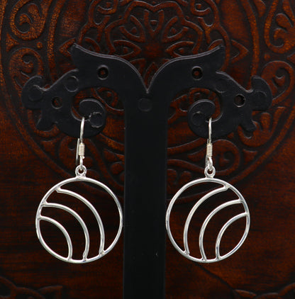 Sterling silver handmade circle hoop earring with drop dangle geometric style, elegant and trendy jewelry by Tribal Ornaments.