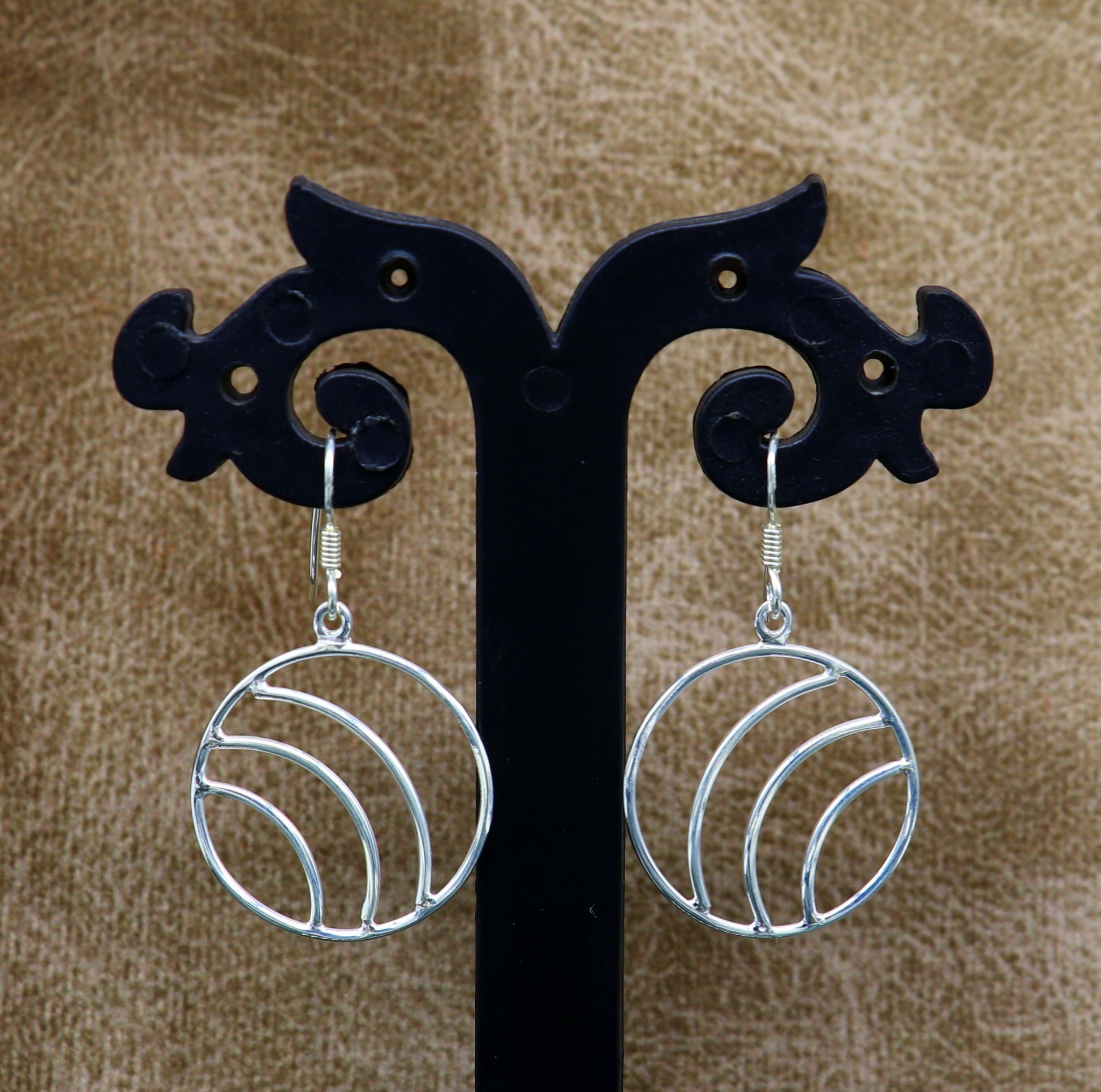 Sterling silver handmade circle hoop earrings by TRIBAL ORNAMENTS, elegant geometric drop dangle earrings for women.