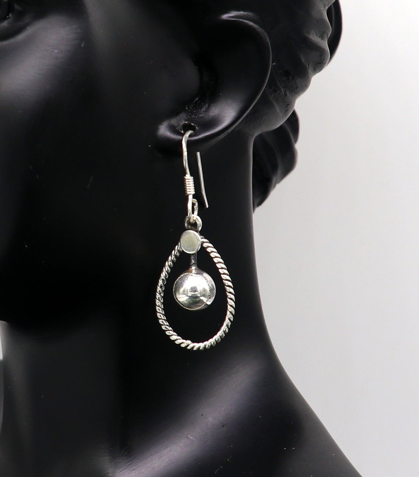 Sterling silver handmade circle hoop earring with geometric drop design by TRIBAL ORNAMENTS, elegant and trendy jewelry for her.