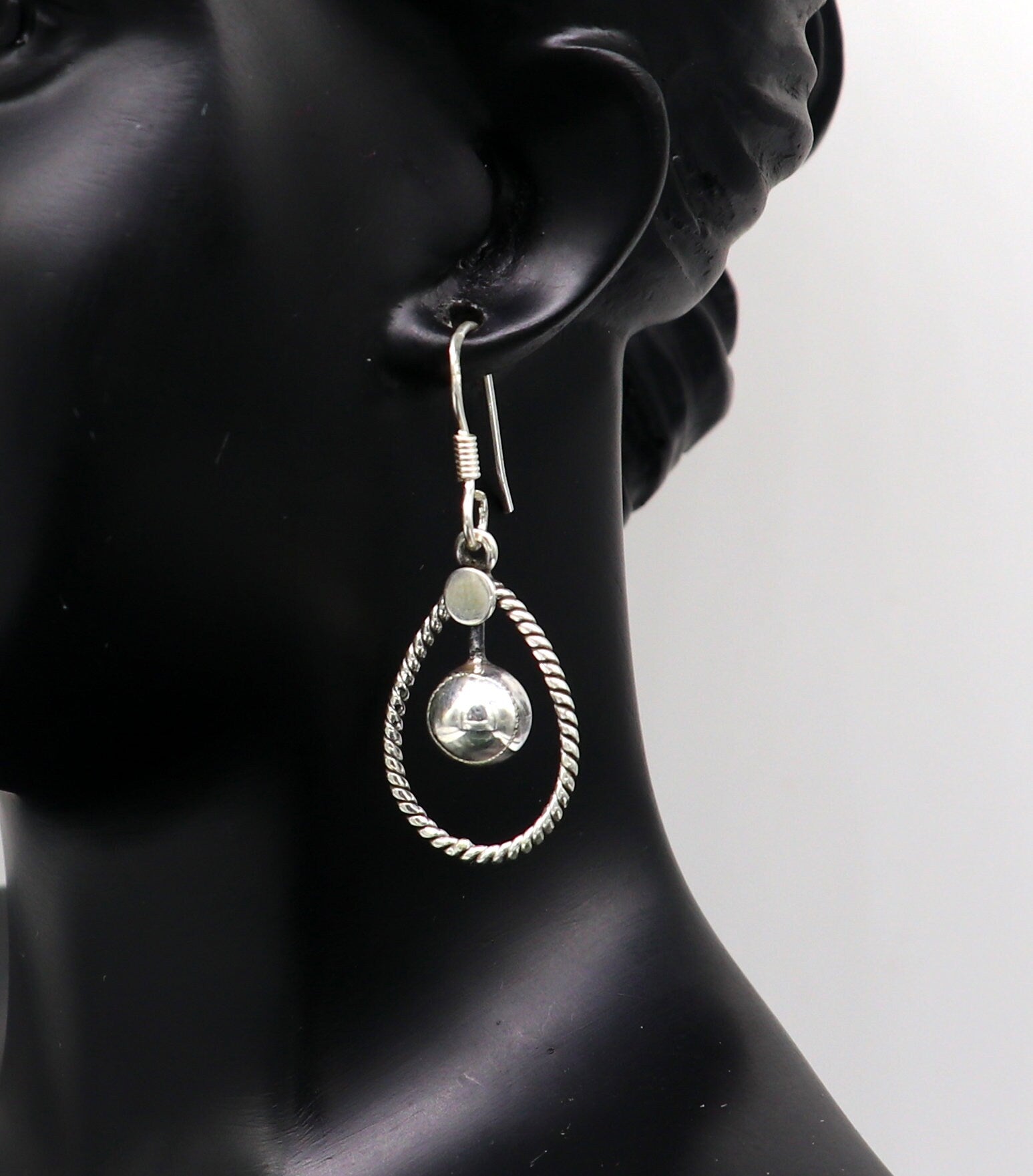 Sterling silver handmade circle hoop earring with geometric drop design by TRIBAL ORNAMENTS, elegant and trendy jewelry for her.
