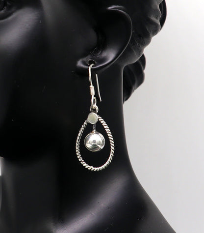 Sterling silver handmade circle hoop earring with geometric drop design by TRIBAL ORNAMENTS, elegant and trendy jewelry for her.