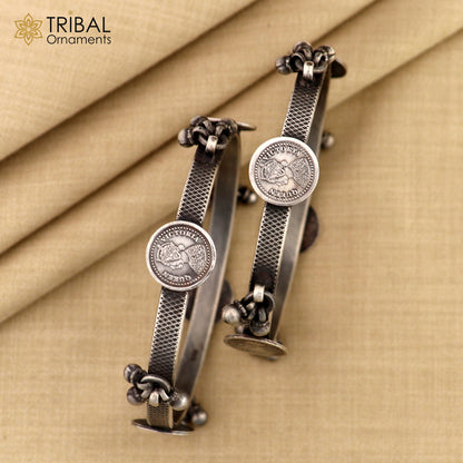 Sterling silver ethnic bangle bracelet with vintage style hanging drops, handcrafted by TRIBAL ORNAMENTS, perfect for gifting.