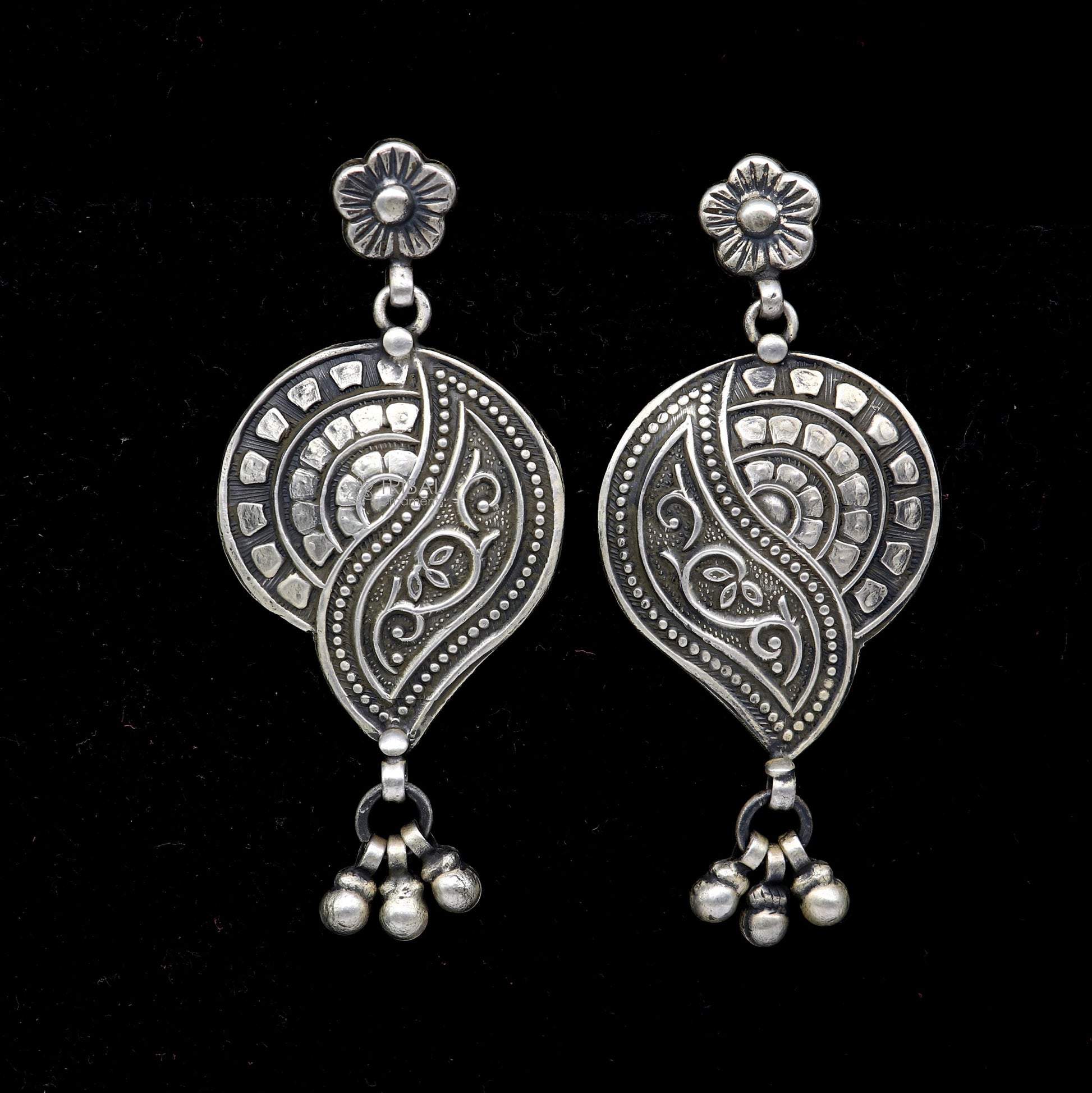 Sterling silver floral drop dangle earring by TRIBAL ORNAMENTS, handmade vintage jewelry with intricate floral design.