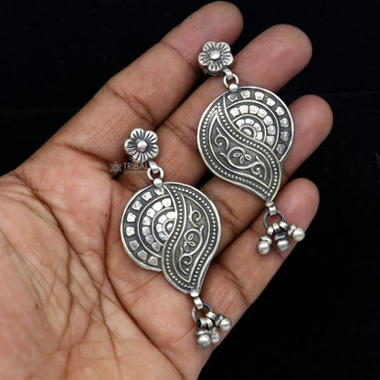 Sterling silver floral drop dangle earring by TRIBAL ORNAMENTS, handcrafted vintage jewelry with intricate floral design and stylish appeal.