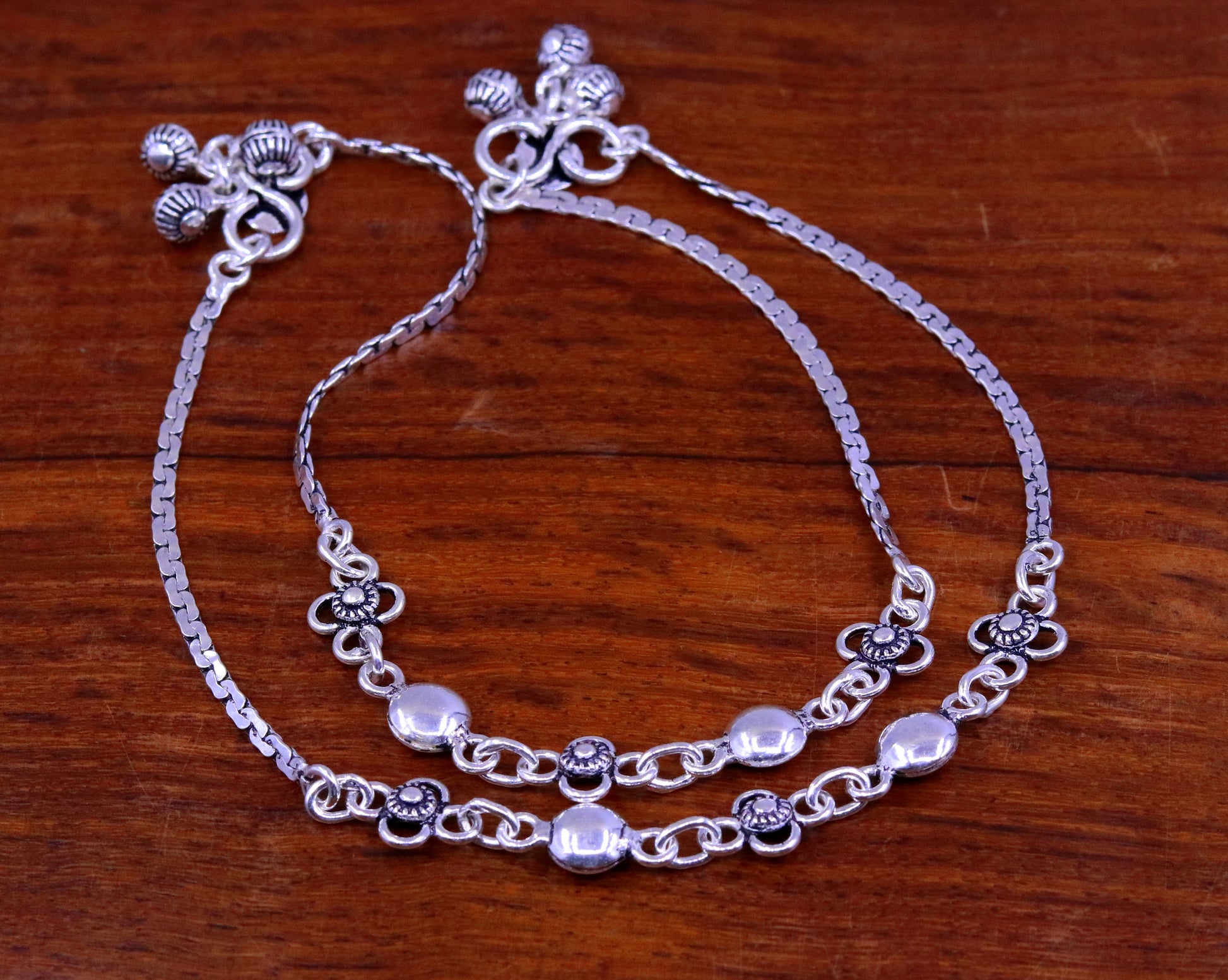 Sterling silver handmade charm anklet, 10.5 inches long, featuring intricate designs, perfect as a foot bracelet or bridal gift.
