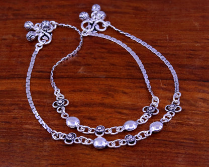 Sterling silver handmade charm anklet, 10.5 inches long, featuring intricate designs, perfect as a foot bracelet or bridal gift.
