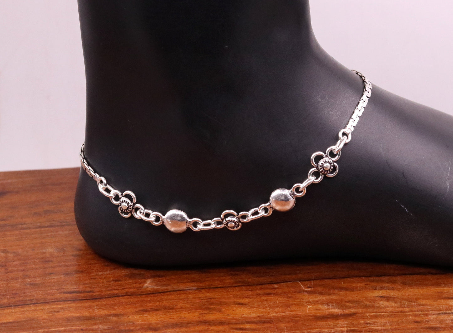 Sterling silver handmade charm anklet, 10.5 inches long, featuring intricate designs, perfect as foot jewelry or bridal gift.