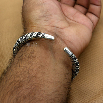 Sterling silver handmade bangle bracelet featuring intricate chitai work, unisex tribal and ethnic jewelry by TRIBAL ORNAMENTS.