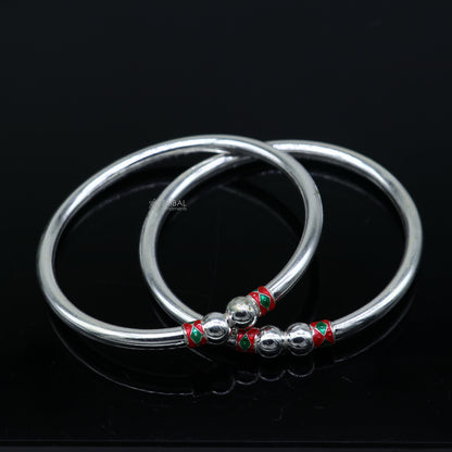 Sterling silver bangle bracelet with a plain shine ball design, handmade tribal jewelry by Tribal Ornaments.