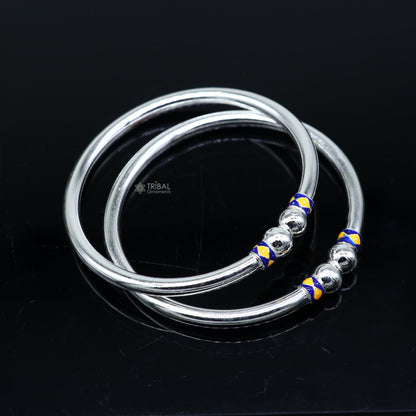 Sterling silver bangle bracelet with a simple shiny ball design, handcrafted jewelry by Tribal Ornaments.