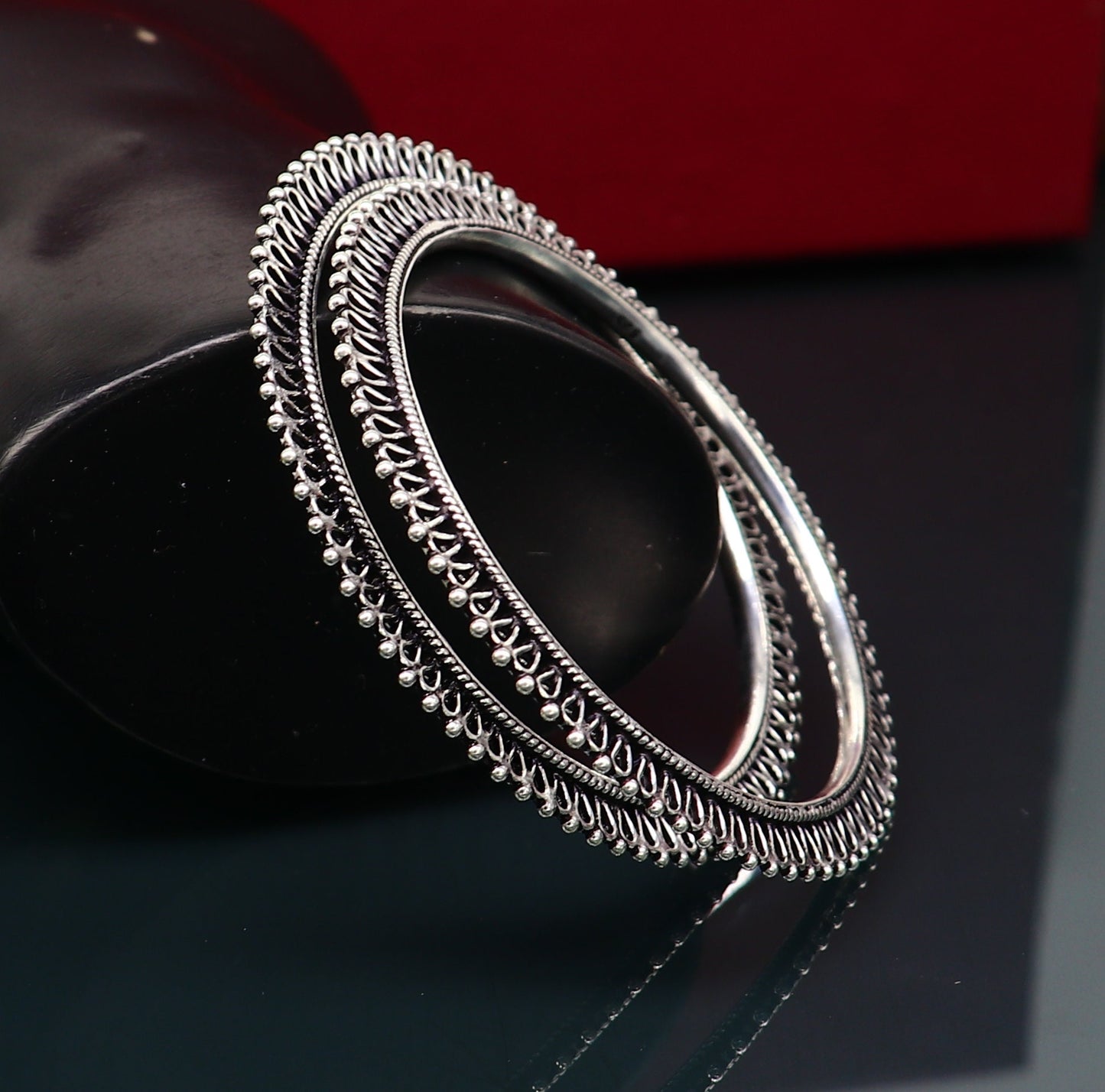 Sterling silver bangle and kada set for brides, handcrafted tribal jewelry for women, featuring intricate design and elegant craftsmanship.