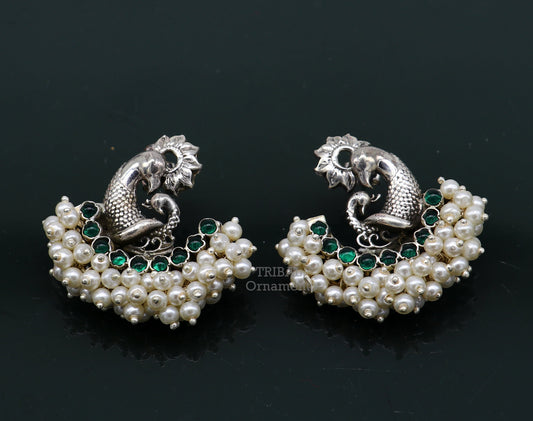 Sterling silver peacock design stud earring with cut stone and pearl, handcrafted tribal jewelry by TRIBAL ORNAMENTS.