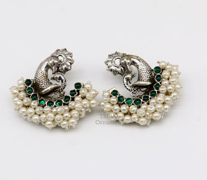 Sterling silver peacock design stud earring with cut stone and pearl, handmade tribal jewelry by TRIBAL ORNAMENTS.