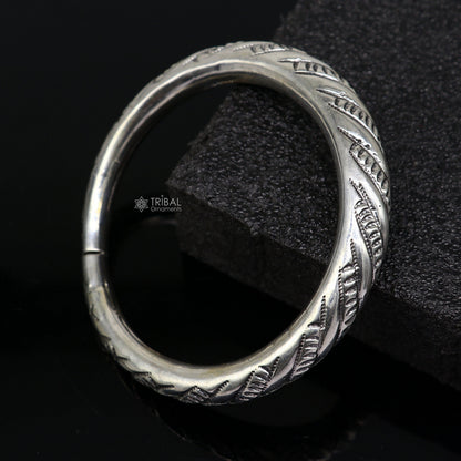 Sterling silver fancy bangle bracelet by Tribal Ornaments, unisex handmade jewelry with intricate design, perfect as personalized gift.