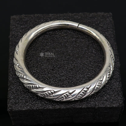 Sterling silver fancy bangle bracelet by Tribal Ornaments, unisex handmade jewelry with intricate design, ideal for personalized gifting.