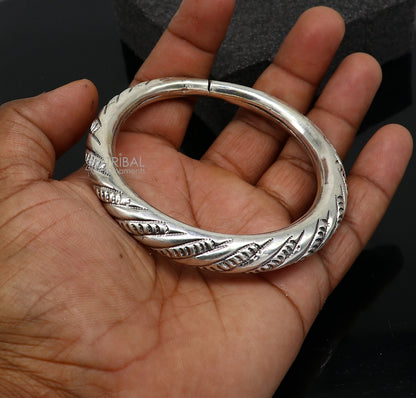 Sterling silver fancy bangle bracelet by TRIBAL ORNAMENTS, handmade unisex jewelry with intricate design, perfect as a personalized gift.