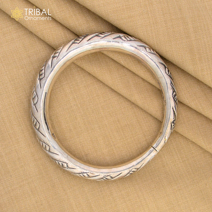 Sterling silver fancy bangle bracelet by Tribal Ornaments, unisex handmade jewelry with intricate design and personalized gift appeal.