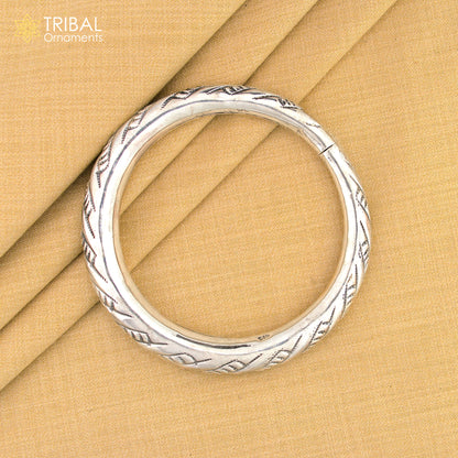 Sterling silver fancy bangle bracelet by TRIBAL ORNAMENTS, unisex handmade jewelry with intricate design, perfect for personalized gift.