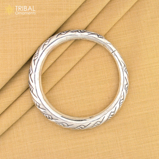 Sterling silver fancy bangle bracelet by TRIBAL ORNAMENTS, unisex handmade jewelry with intricate design, perfect for personalized gift.