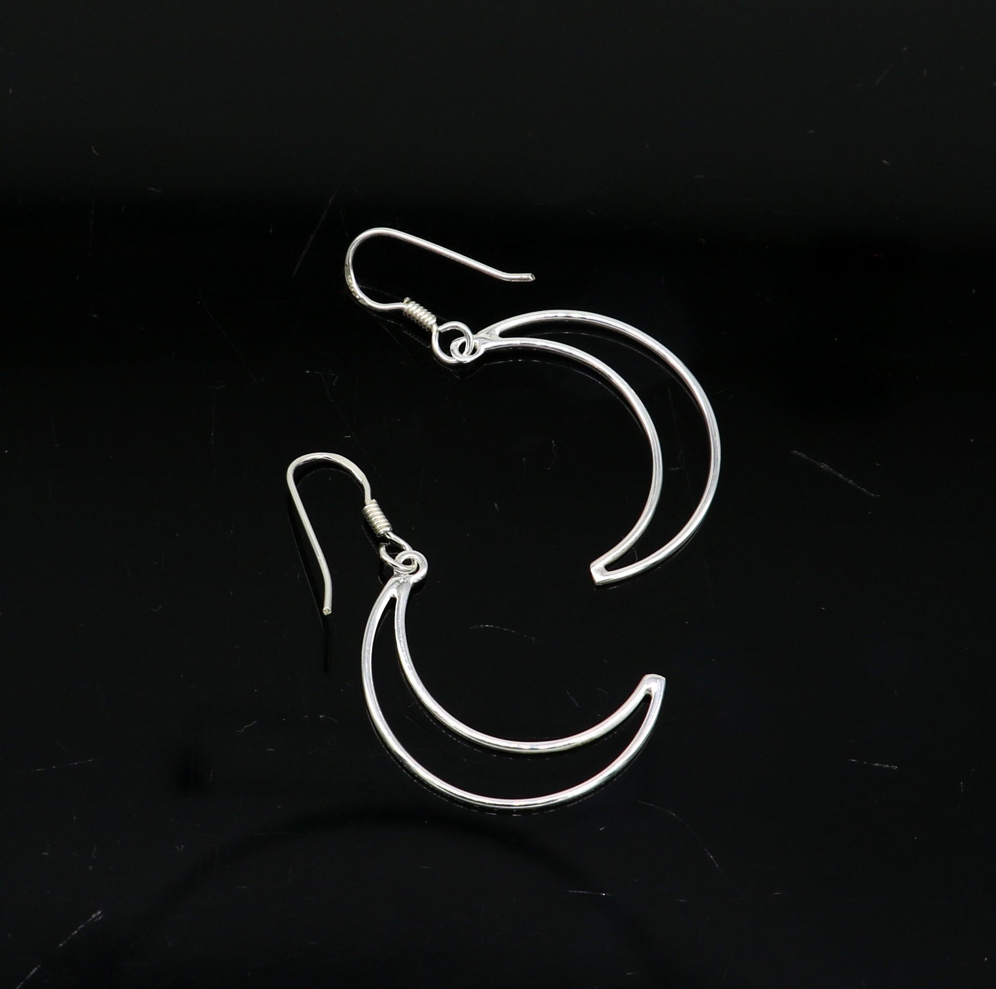 Sterling silver handmade half-moon arc hoop earring with geometric drop design, elegant and trendy for stylish women.
