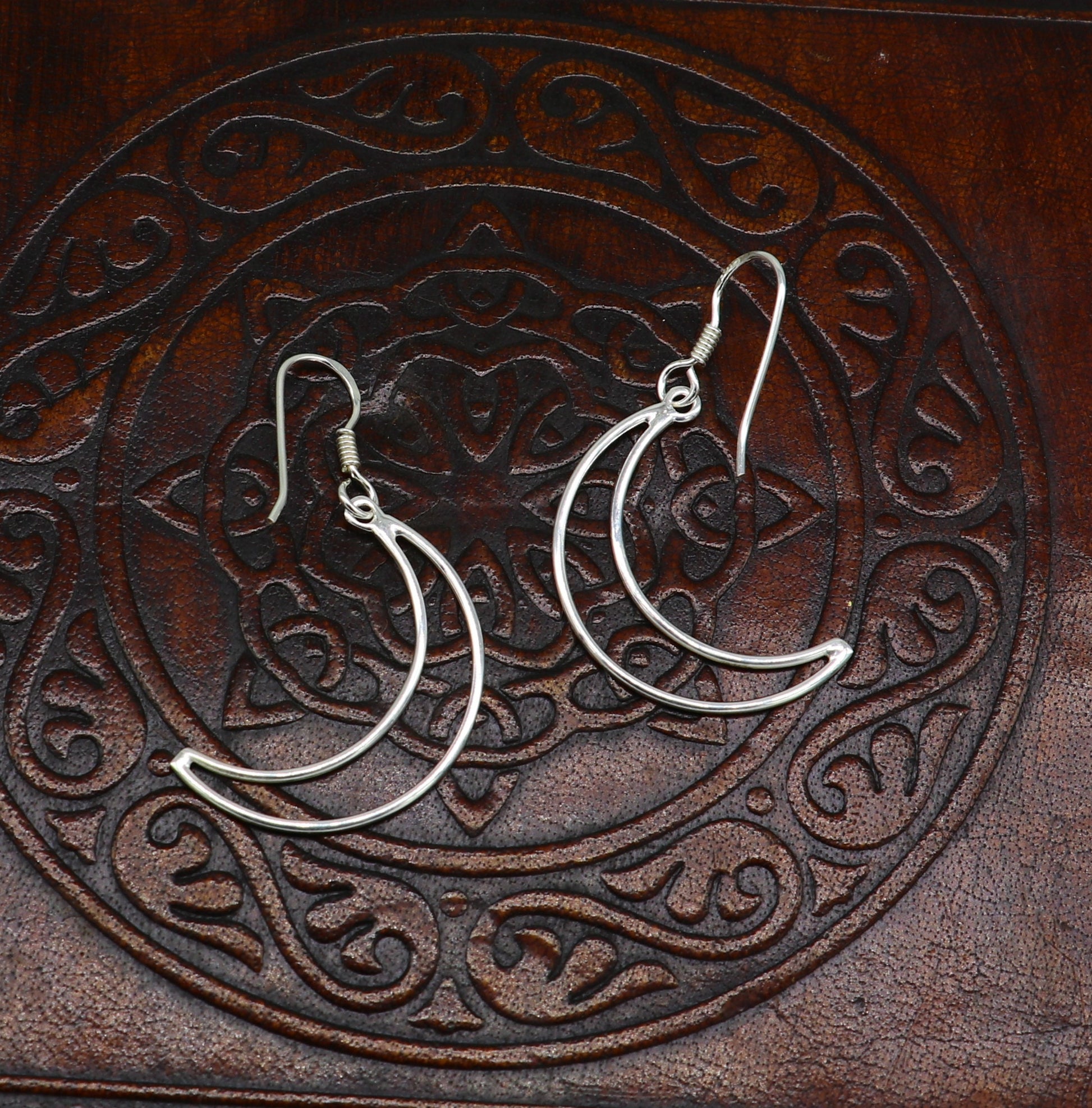 Sterling silver half moon arc hoop earring by TRIBAL ORNAMENTS, elegant geometric drop earring with plain, trendy design.