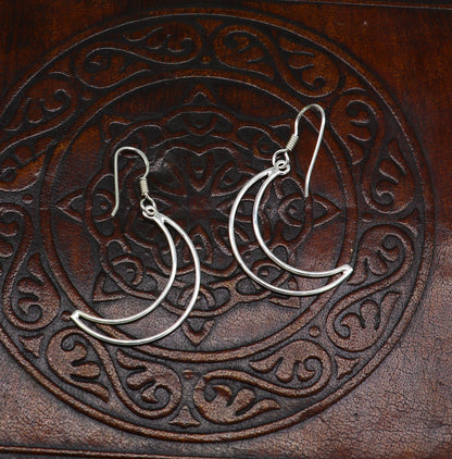 Sterling silver half moon arc hoop earring by TRIBAL ORNAMENTS, elegant geometric drop earring with plain, trendy design.