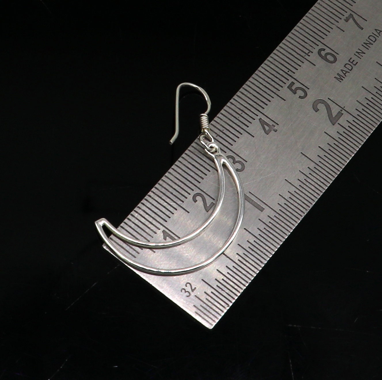 Sterling silver handmade half moon arc hoop earring with elegant geometric design, trendy drop dangle style from TRIBAL ORNAMENTS.