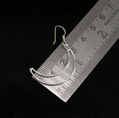 Sterling silver handmade half moon arc hoop earring with elegant geometric design, trendy drop dangle style from TRIBAL ORNAMENTS.