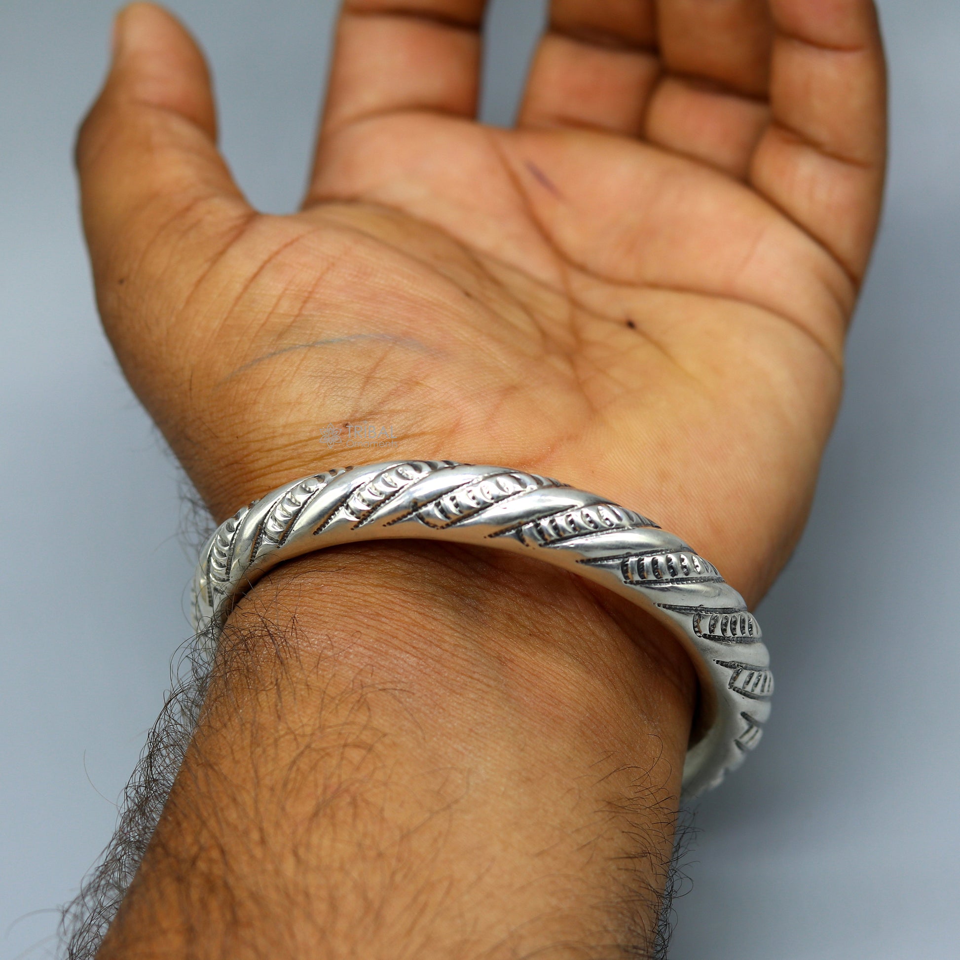 Unisex 925 sterling silver handmade heavy bangle bracelet with intricate tribal design from TRIBAL ORNAMENTS.