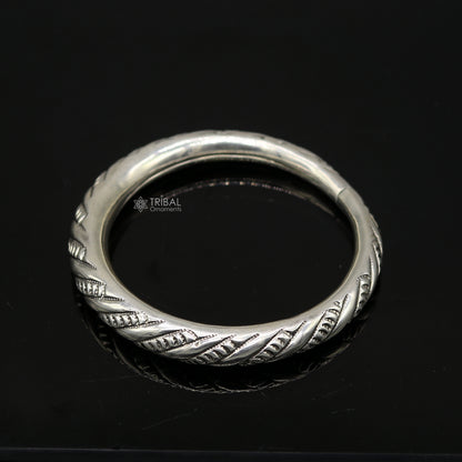 Unisex 925 sterling silver heavy bangle bracelet with intricate tribal design, handmade jewelry by Tribal Ornaments.