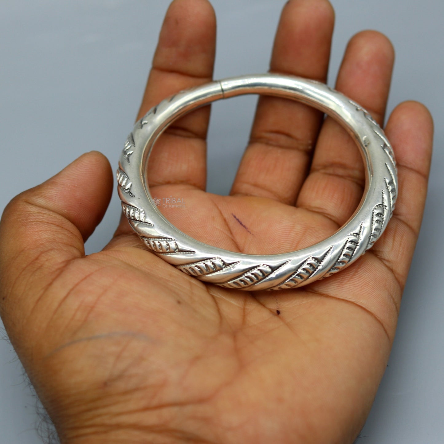 Unisex 925 sterling silver handmade heavy bangle bracelet with intricate tribal design, crafted by TRIBAL ORNAMENTS.