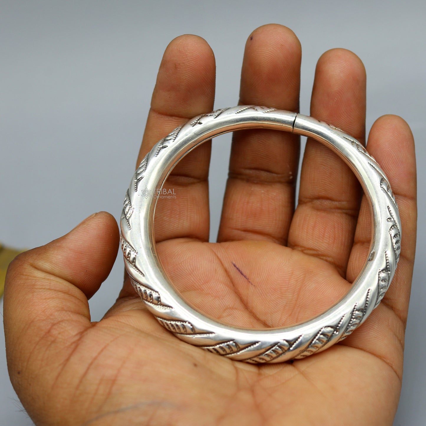 Unisex 925 sterling silver handmade heavy bangle bracelet with traditional tribal design, crafted by TRIBAL ORNAMENTS.
