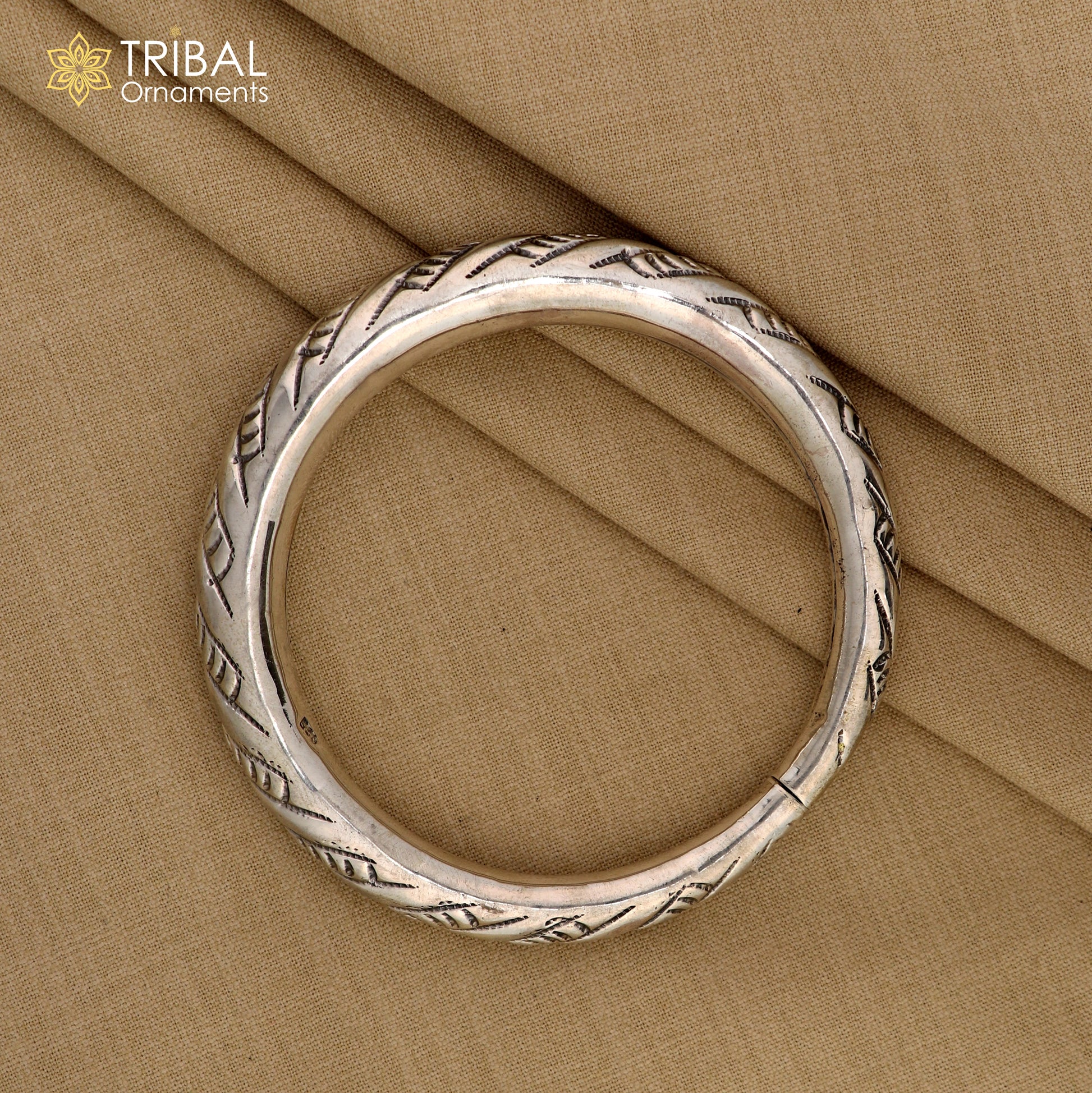 Unisex 925 sterling silver handmade heavy bangle bracelet with intricate tribal design from TRIBAL ORNAMENTS.