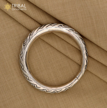 Unisex 925 sterling silver heavy bangle bracelet with intricate tribal design, handmade jewelry by Tribal Ornaments.