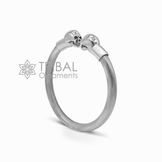 Sterling silver human skull design bangle cuff bracelet for unisex, handmade by Tribal Ornaments, stylish and edgy jewelry piece.
