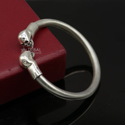 Sterling silver skull design bangle cuff bracelet for unisex, handmade tribal ornament jewelry with bold human skull detail.