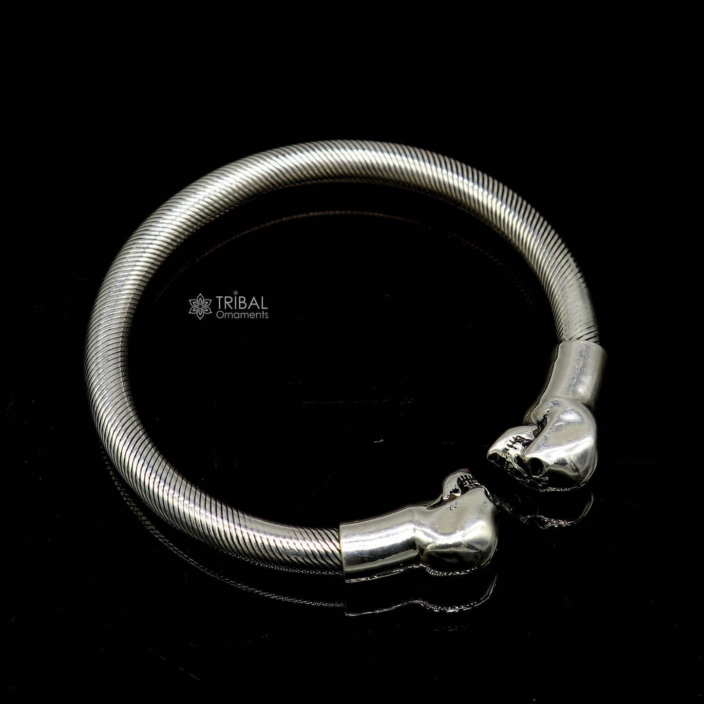 Sterling silver human skull design bangle cuff bracelet for unisex, crafted by Tribal Ornaments, featuring detailed skull artwork.